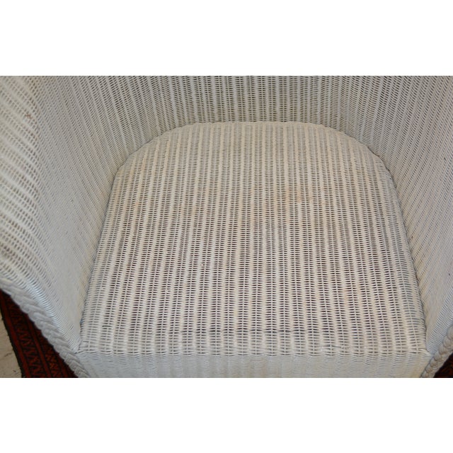 This chair is in good shape overall! Great for a patio or porch. No cushion is included. Normal wear to the arm areas....