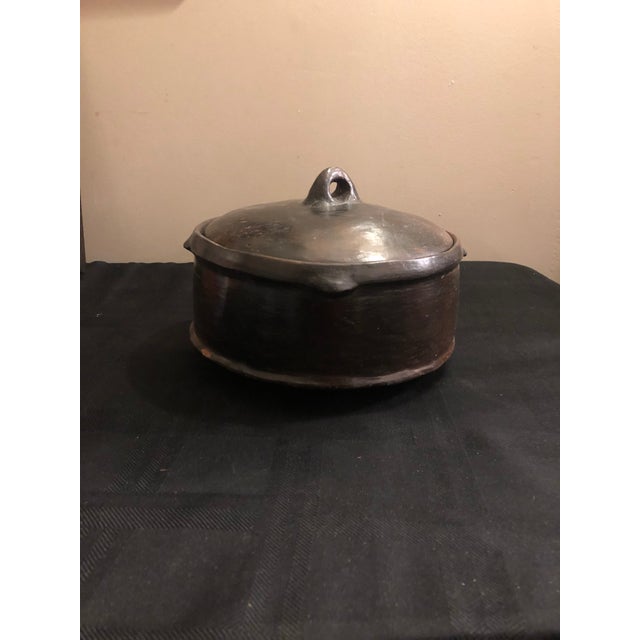 A striking piece of authentic African ethnographic art, this vintage lidded clay vessel (Shekla) was originally acquired...