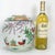 A large, colorful, hand painted Chinese polychrome ginger jar with a design of roosters in a garden. The hand thrown...