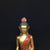 This is a vintage gilt bronze figure of a seated Buddha. The statue features a serene expression with downcast eyes and a...