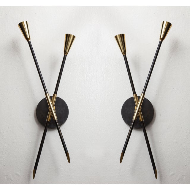 Pair of brass and bronze sconces inspired by midcentury design. Please view our other listings for this piece in various...