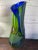 This studio glass vase in greens and blues is stunning with its' elegant lines, purity of color, surface sculpted in...