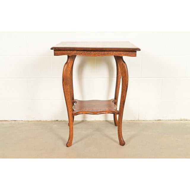 A beautiful antique Victorian carved oak parlor table or side table USA, Circa 1900 Measures: 24"W x 24"D x 29.5"H. Very...