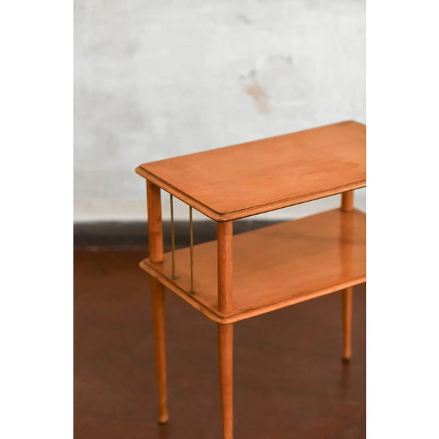 Mid-Century wooden side table with double shelves, thin legs and brass details. Product details Dimensions 60 W x 64 H ×...