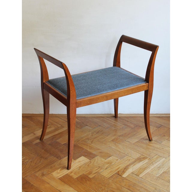An original Art Deco piano stool or tabouret dating from the 1920s. Featuring beautifully sculpted curved legs that rise...
