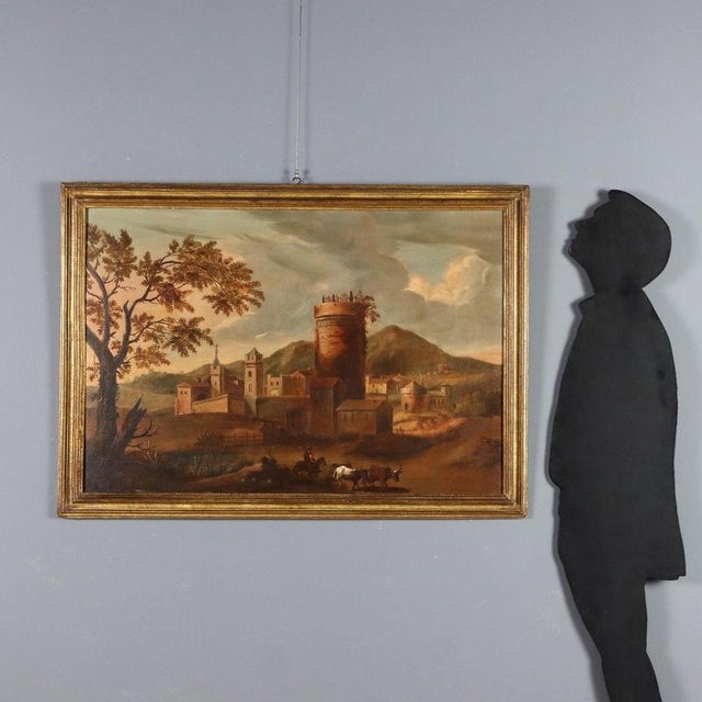 Oil on canvas. 18th-century Italian school. Amidst a rather barren coastal countryside, a small village stands out,...