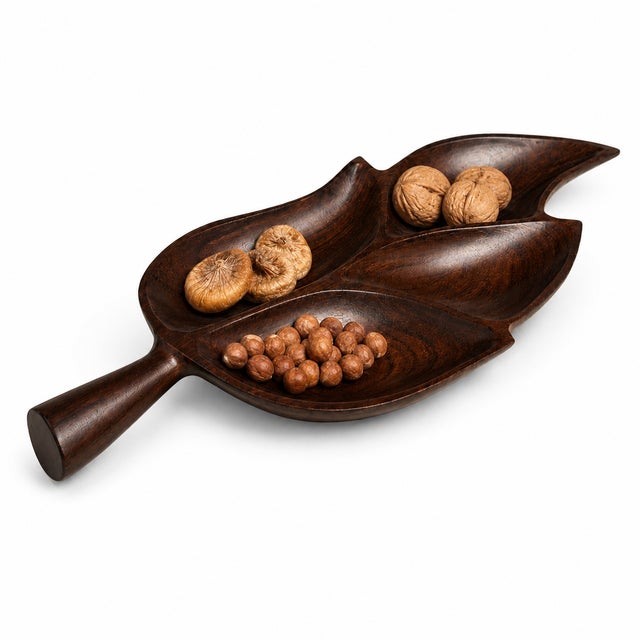 A beautifully sculptural serving tray handcrafted in richly figured rosewood, designed in an elegant organic leaf form...