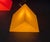 Postmodern prism-shaped floor/table lamp by Heico. Shown here in yellow. These lamps feature the graphic form of a prism....