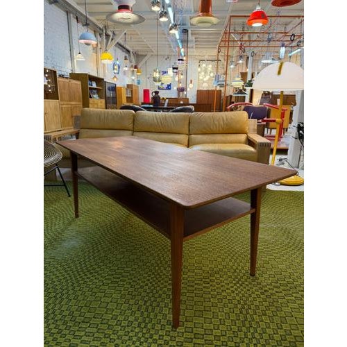 Scandinavian coziness: This restored coffee table from Denmark impresses with its timeless, warm teak aesthetic and...