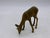 Lot of five collectible deers from the 1950s including a wood thermometer, 2 statues, a candle holder, and an ashtray....