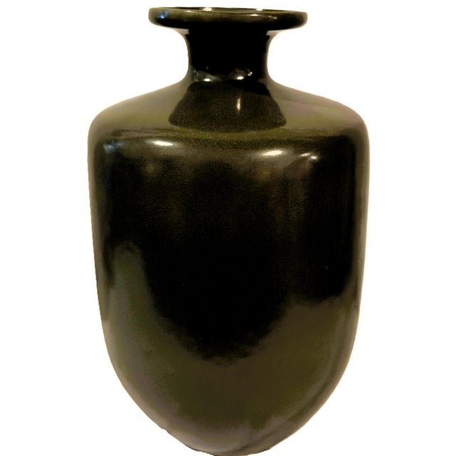 Bring earthy warmth, tactile depth, and sculptural scale to your interior with this large 14-inch studio ceramic bottle...