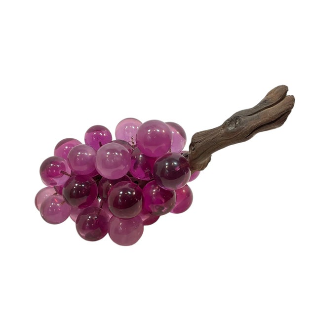 A charming vintage Lucite grape cluster featuring rich, glossy purple grapes. The grapes are varying colors and opacity....