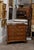 An English Regency period five-drawer commode with banding on the drawers and ogee bracket feet from the early 19th...