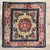 Hand-knotted wool rug measuring 2'0" x 2'2" (24" x 26"), featuring a central floral medallion with stylized botanical and...