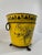 A striking yellow and black Italian Tole Cachepot or Planter from Mid to Late 20th Century. "Made in Italy" with maker's...