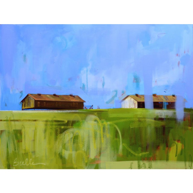 This oil painting depicts two rustic structures set against a serene blue sky, conveying a sense of quiet solitude. The...