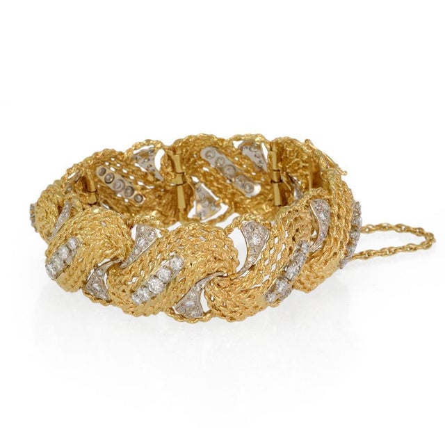 This is a gorgeous Estate bracelet, crafted from 18k yellow and white gold featuring long curved shape textured open style...