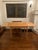 Beautiful mid-century blonde oak wood dining table with stow away side expansion leaves by Mobler made in Denmark. Side...