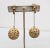 1966 goldtone filigree ball drops with small filigree ball drops clip earrings. Marked "NAPIER©" on the clips. Measure: 3...