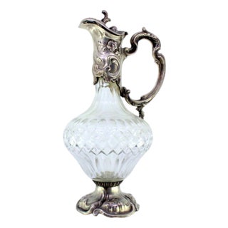 Cut Glass Wine Jug with Neck, Handle and Base in Silver Relief with Scrolls and Floral Motifs For Sale