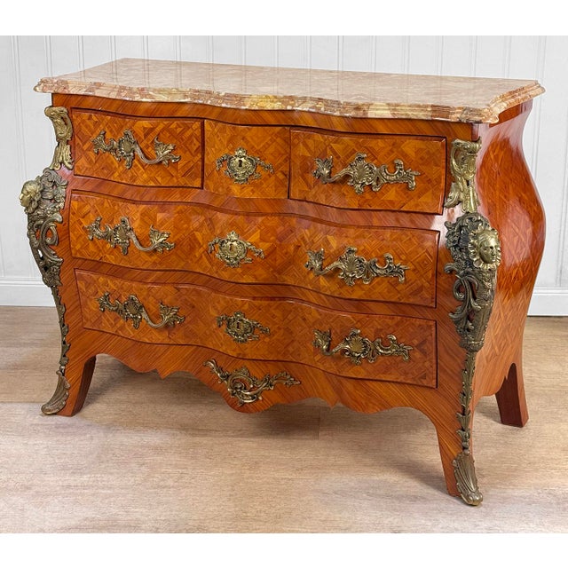 A French Louis XV Style Bombe Commode Chest Heavily Decorated Marquetry Veneered Finish Robust Figural Ormolu Sides with...