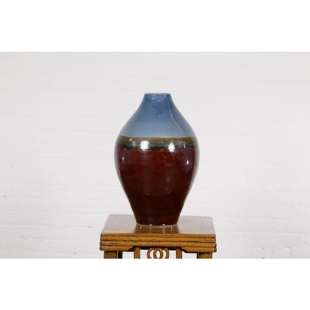 Contemporary Prem Collection ceramic vase with blue and reddish brown colors. Introducing an exquisite piece from the Prem...