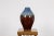Contemporary Prem Collection ceramic vase with blue and reddish brown colors. Introducing an exquisite piece from the Prem...