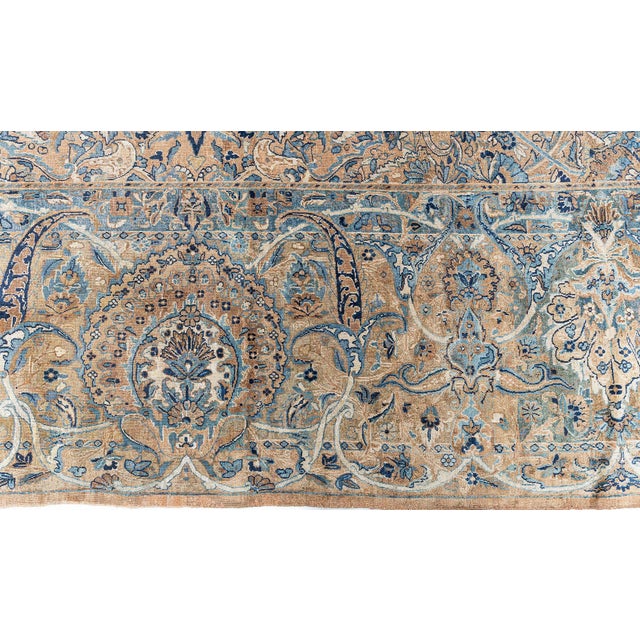 This circa-1880 antique Persian Kirman rug has an over-all densely spaced design of serrated leaves, palmettes and floral...