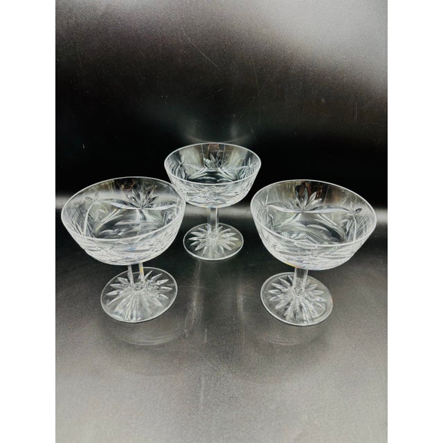 Elevate your barware collection with this elegant set of three “Ashling” Waterford Crystal champagne coupes. Expertly...