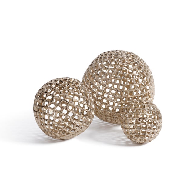 Add dimension and a touch of metallic texture to your space with this decorative woven metal orb. Crafted from aluminum...