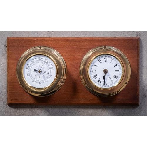 Authentic vintage ships clock and barometer crafted from warm teak wood and polished brass, dating back to the 1960s. This...