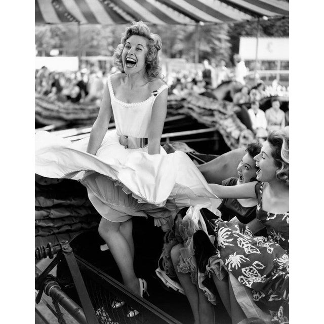 Fun Fair Fun 1st June 1957: Sherree Danton, Pat Lawrence and Wendy Graham enjoying the wind machine at the opening of the...
