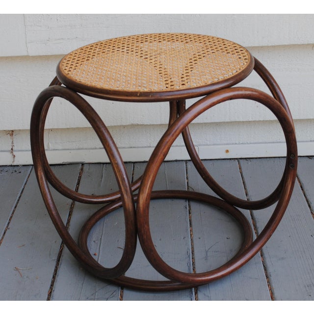 1960's bentwood and caned wicker ottoman. This ottoman is lightweight and blends well with more than just mid-century...