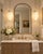 A striking matched pair of vintage hanging swag lamps featuring sculptural white milk glass shades with deeply dimensional...
