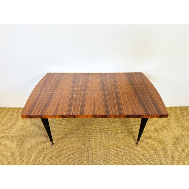 Art Deco dining table with a varnished walnut top dating from the 1940s. This elegant Art Deco table stands out for its...