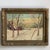 A small and lovely mid-20th century winter farmhouse landscape painting -- oil on board. Beautifully rendered in warm,...