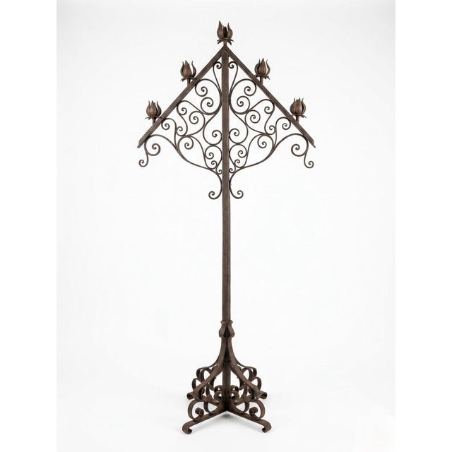 This striking vintage Italian floor candelabra is a masterclass in hand-wrought ironwork, blending architectural structure...