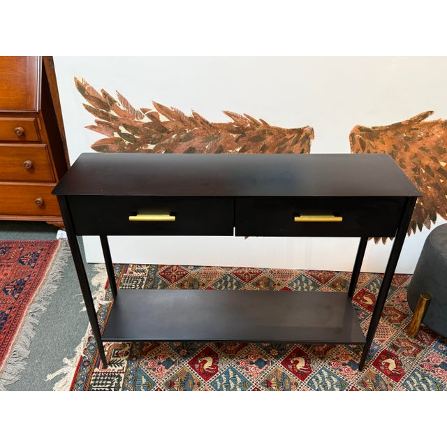 Design Plus Gallery presents the Metalwork Console Table from West Elm. The table is with clean lines and simple...