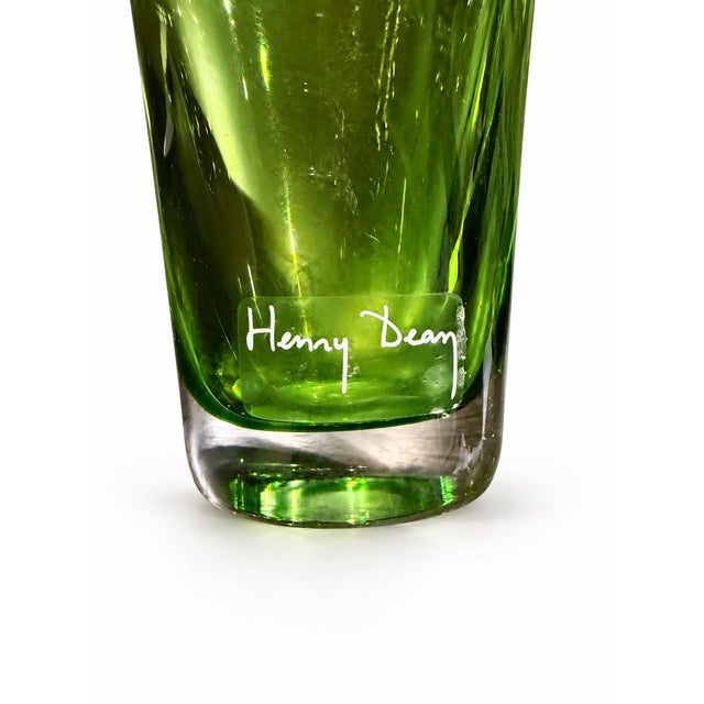 A single hand-blown Henry Dean glass in luminous lime green. Its gently flared rim, tapered shape, and substantial clear...