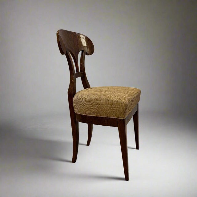 Pair fine pair of Biedermeier Side Chairs crafted with Walnut burl veneers. The back is a pierced design and the chair...