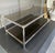 Square tubular steel frame, chrome in very good condition with minimal signs of wear. Smoked glass shelves with beveled...