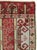 This Early 20th century Turkish Ghiordes rug, measuring 1' 11" x 3' 2", presents a striking example of the Anatolian...