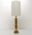 Scandinavian lamp produced by enco in the 1960s, recognizable by its base composed of a succession of gilded brass...