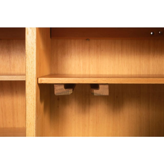 Two tone cabinet constructed from teak w/ black powder coated detailing on the cabinet base, the drop down door face and...