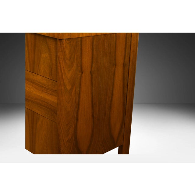 An elegant Mid-Century Modern 9-Drawer Dresser c. 1960s. This is a beautiful example of Mid-Century craftsmanship designed...