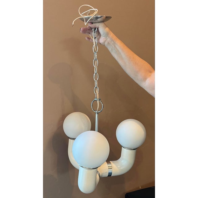 Very unique mid century 1960s space age 3 arm / globe pendant chandelier . Arms are made of acrylic with chrome accents....