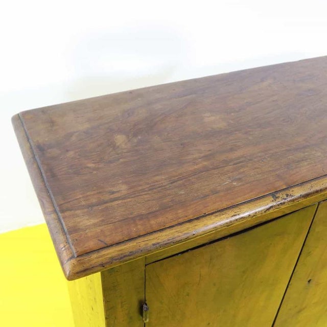 Solid wood sideboard featuring two doors and a beautifully shaped base.