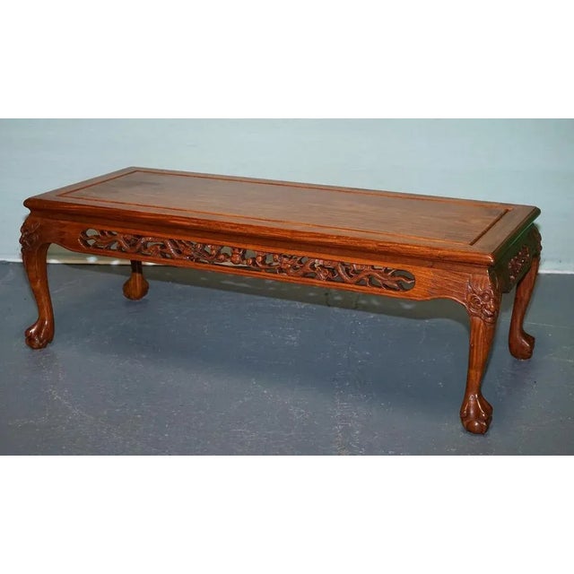 Antiques of London An exquisite vintage Chinese coffee table featuring intricate hand-carved detailing in solid wood. The...