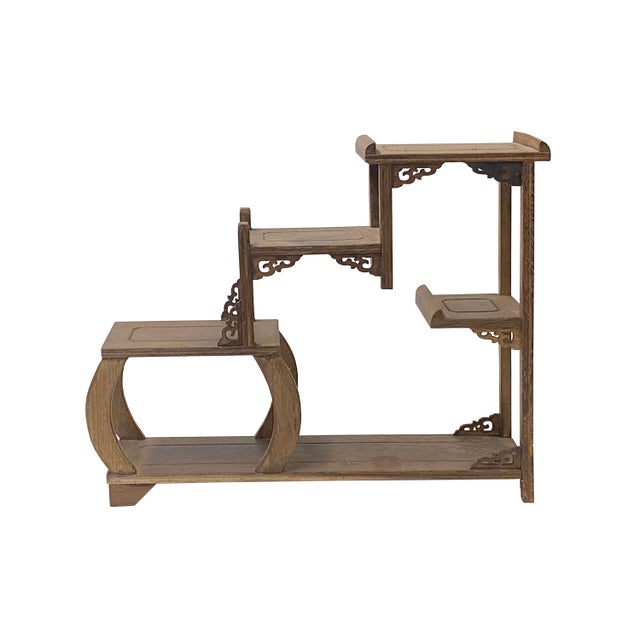 This is an oriental small tabletop curio display stand/easel with gray brown color in a tower step shape. Dimensions: w14"...