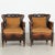Pair of 20th century Danish club chairs upholstered in vintage brown leather with a design reminiscent of Otto Schulz....